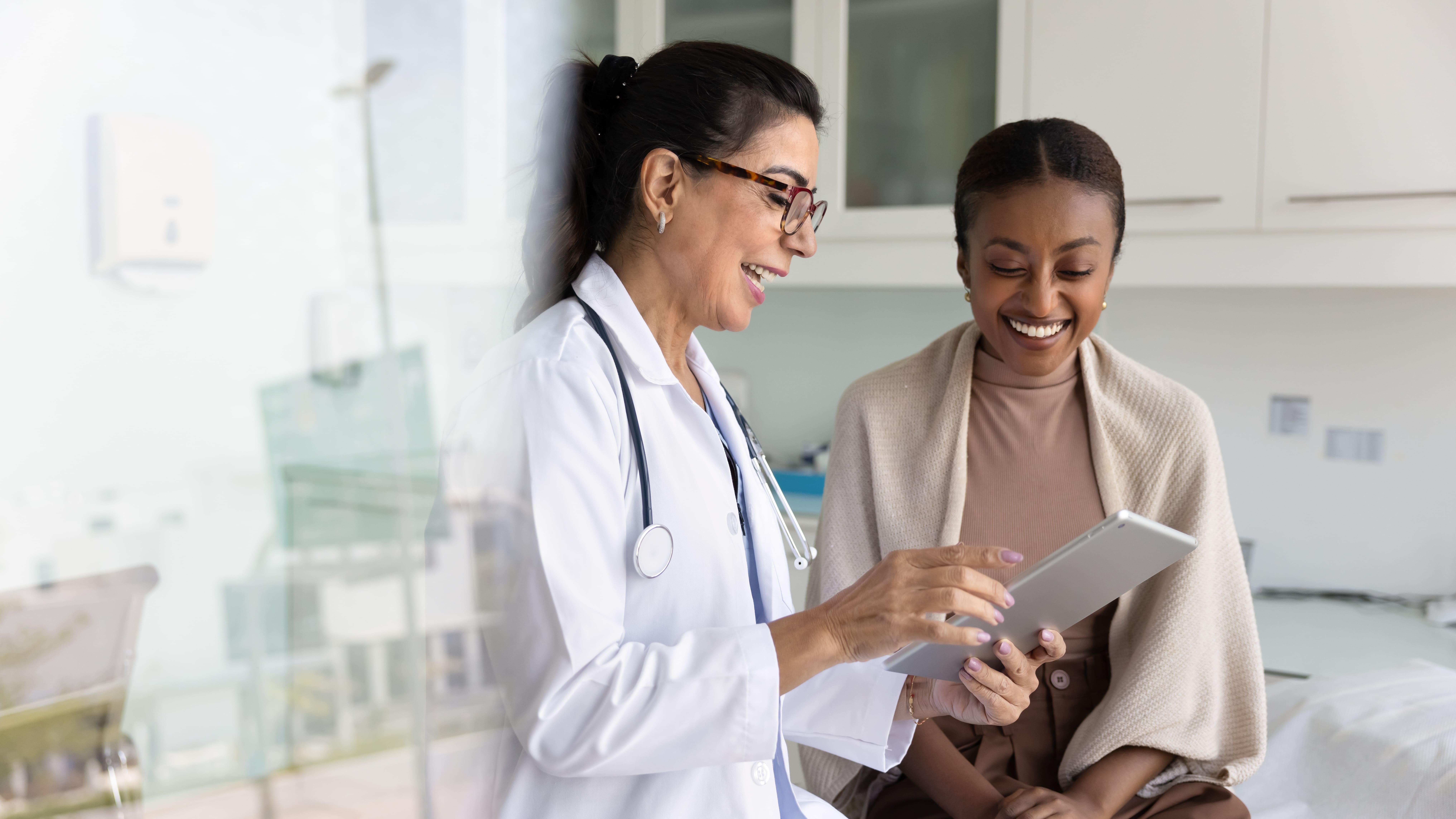 Female healthcare professional reviewing results with a female patient.